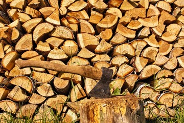 The ax on the background of woodpile