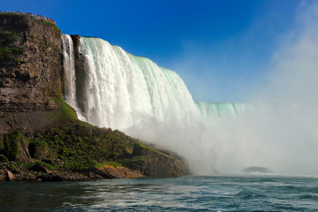Fototapeta premium Tourists observing Niagara Falls on the observation deck