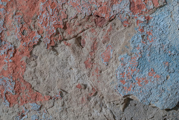 old chipped plaster on the concrete wall, chipped paint, texture, background