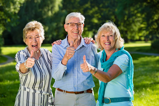 Three senior friends showing optimism.
