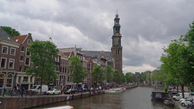 The Wester Toren (tower) with left the Anne Frank house and the Prinsengracht Canal in the center of the city