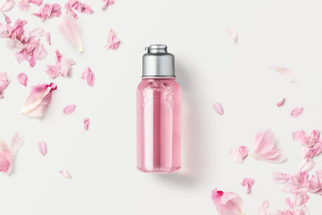 cosmetics / beauty product mockup with blank bottle with pink liquid soap or shower gel on a white...
