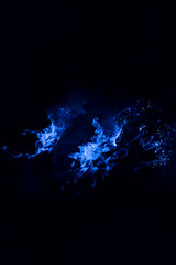 Blue flame. Burning of rice straw at night.