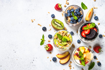 Fototapeta na wymiar Fruit Dessert in glasses with yogurt and berries.
