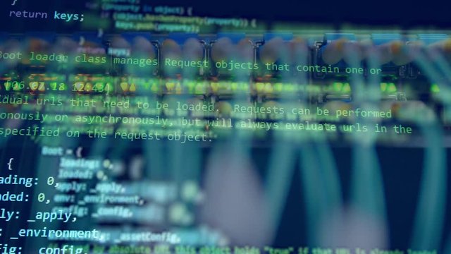 Computer wires on a programming code background.