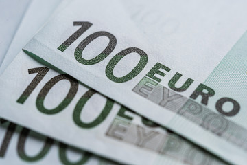 Close up of euro currency, bills of 100 euros. Concept of finance, business, banking, debt, and European Union.