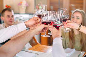 Close-up Of Friends Toasting Wineglasses At Party