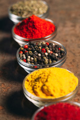 The Different Spices. Spices on stone background.
