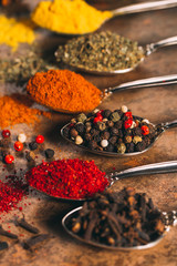 The Different Spices. Spices on stone background.