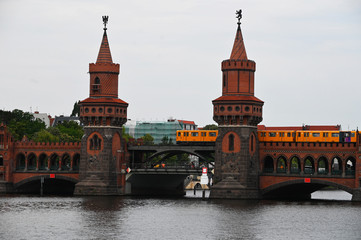 the oberbaumb bridge in Berlin with the passage of the railway train