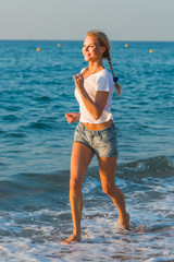 Female in white T-shirt is jogging