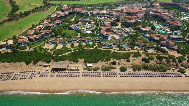Aerial drone panoramic video of famous sandy deep turquoise - blue exotic beach of Navarino in Messinia, Peloponnese, Greece