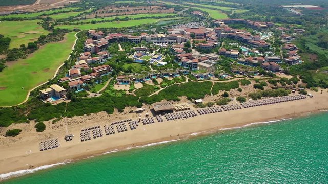 Aerial drone panoramic video of famous sandy deep turquoise - blue exotic beach of Navarino in Messinia, Peloponnese, Greece