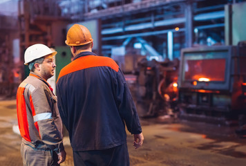 Workers in the steel mill.