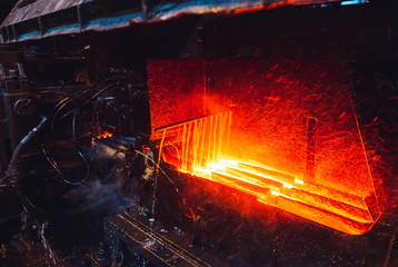 hot steel on conveyor in steel mill