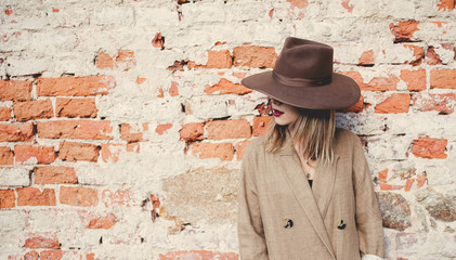 woman in style hat and jacket