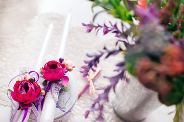wedding candles for the ceremony are decorated with peonies on t