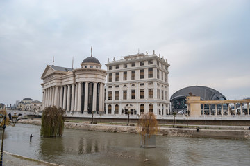 Fototapeta na wymiar Vardar river crossing through Skopje downtown.