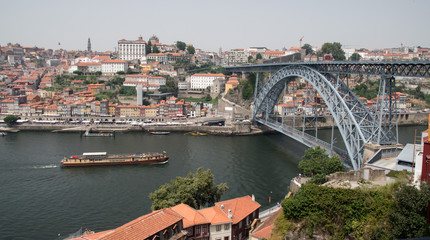 Fototapeta na wymiar The Dom Luis I Bridge, a double deck metal arch bridge that crosses the Douro River in Porto, Portugal. 
