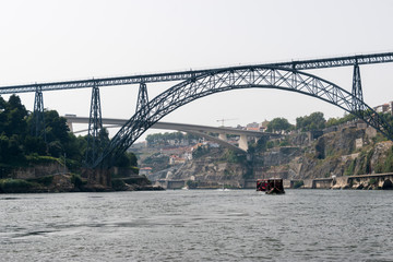 Fototapeta premium The Maria Pia Bridge (Ponte de D. Maria Pia), railway bridge over the Douro River in Porto, Portugal