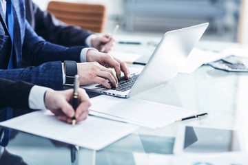 business team conducting analysis of marketing reports at the workplace