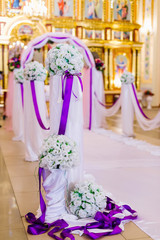 Fototapeta na wymiar Beautiful flower wedding decoration in a church.