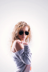 portrait of beautiful blonde girl in dark glasses with curly hai