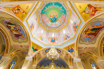 Fototapeta na wymiar view of the dome of the church with frescoes.