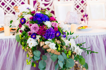 close-up of a beautiful flowers composition on the wedding table