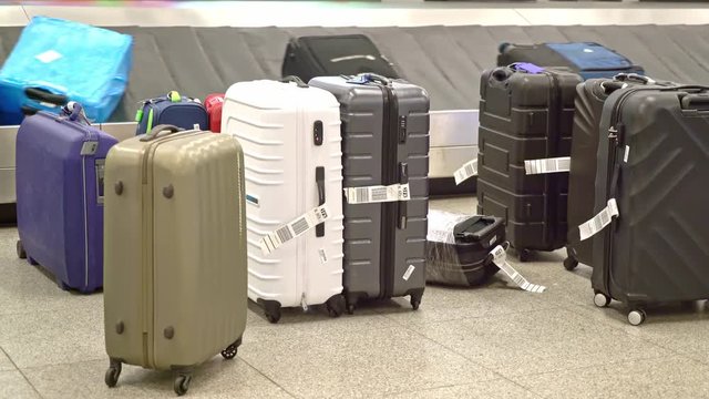 New York, United States, June 10, 2018: Luggage on baggage carousel waiting for travelors at the depature hall of John F. Kennedy airport