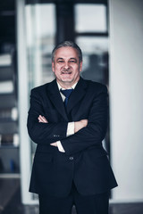 Fototapeta premium portrait of a successful businessman on background of modern office