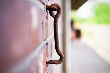 Obraz premium Door hook hanging on a brick wall