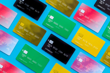 Pay by card concept on blue background top view pattern