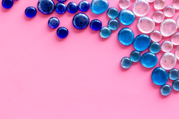 Bright stones frame on pink background top view mock up