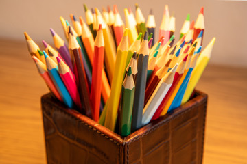 Variety of colored sharpened pencils standing upright in a box © Andrew Atkinson