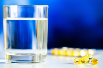 Vitamins supplements, fish oil in yellow capsules omega 3.