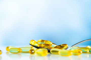 Vitamins supplements, fish oil in yellow capsules omega 3.