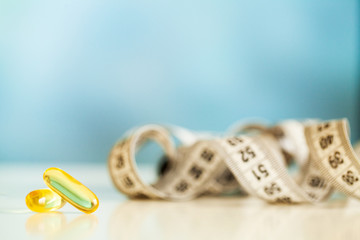 Vitamins supplements, fish oil in yellow capsules omega 3.