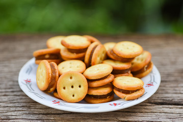 Homemade cookies with jam pineapple on wood table - biscuits cookies on plate for snack cracker