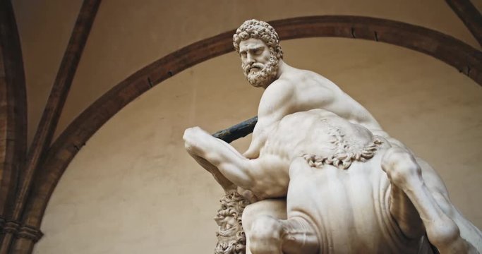 Piazza della Signoria, Florence. Inside beautiful open-air arched gallery Loggia dei Lanzi. Amazing roman marble statue of Hercules killing the centaur Nessus.