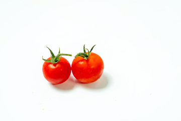 Fresh cherry tomatoes isolated on white background.	