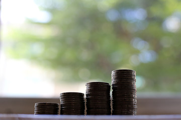 Thailand's money is put together as a window near the window.