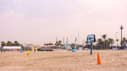 Sand beach view to Burj al Khalifa - obrazy, fototapety, plakaty