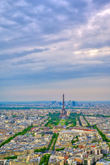 An aerial view of the Eiffel Tower and Paris, France at dusk..