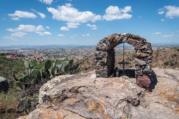 Christian memorial cross with view of San Miguel de Allende Mexico