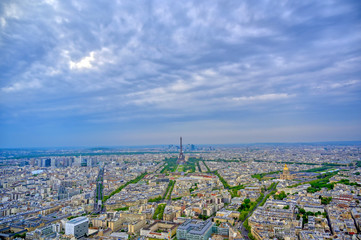 An aerial view of the Eiffel Tower and Paris, France at dusk..