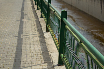 Iron railings next to the water channel