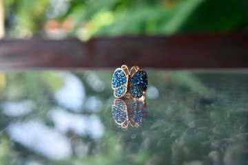 The butterfly ring is a blue topaz with beautiful colors. For ladies