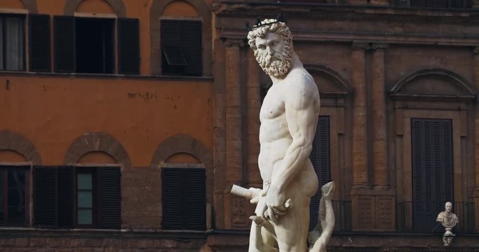 Amazing statue of Neptune on the wonderful old Piazza della Signoria. Fontain of Neptune in Florence, Italy. Tourist attraction landmark. Tuscany.