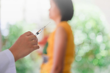 Closeup of doctor hand are vaccinations to patients using the syringe.Medical concept